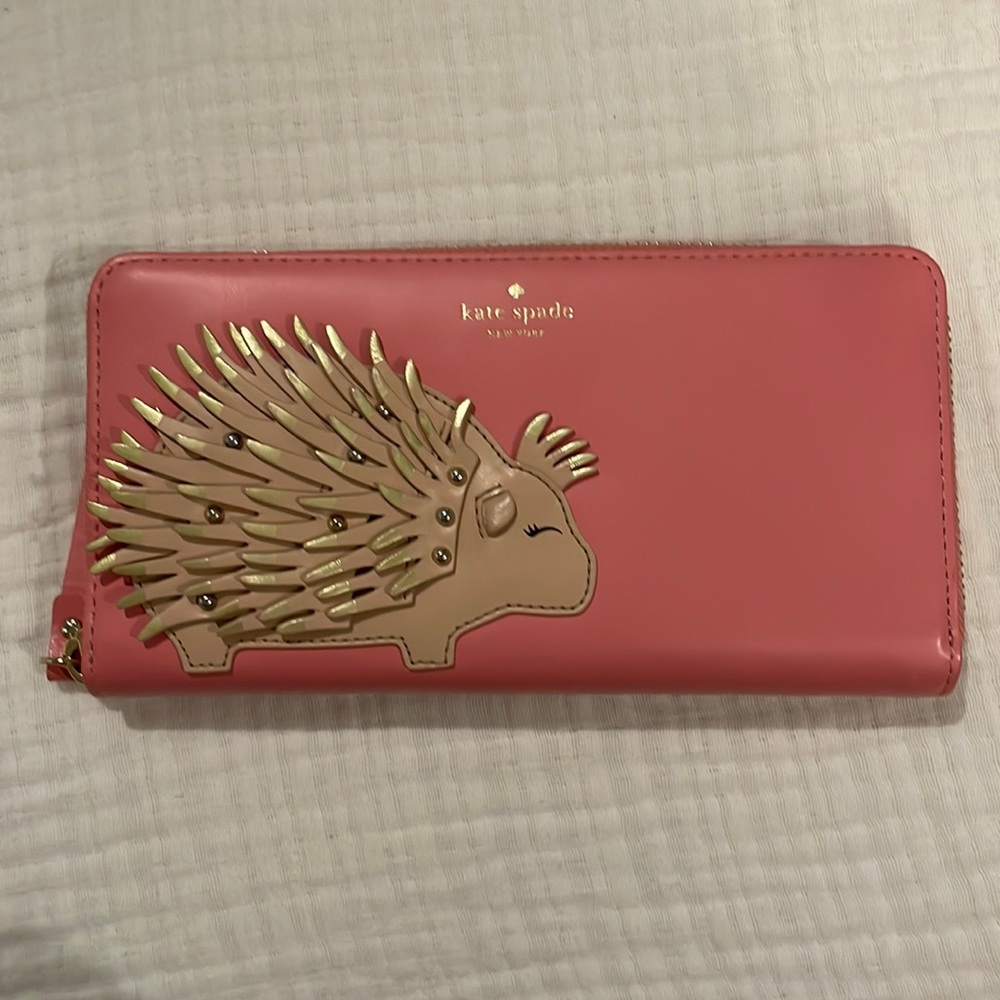 Beautiful Kate Spade wristlet in pink with porcupine decall